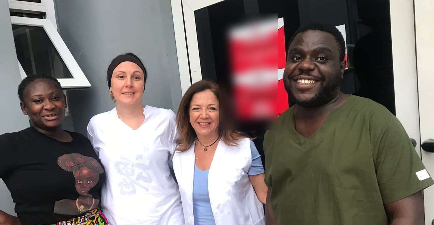 CME's escort with staff outside the facility in Ghana